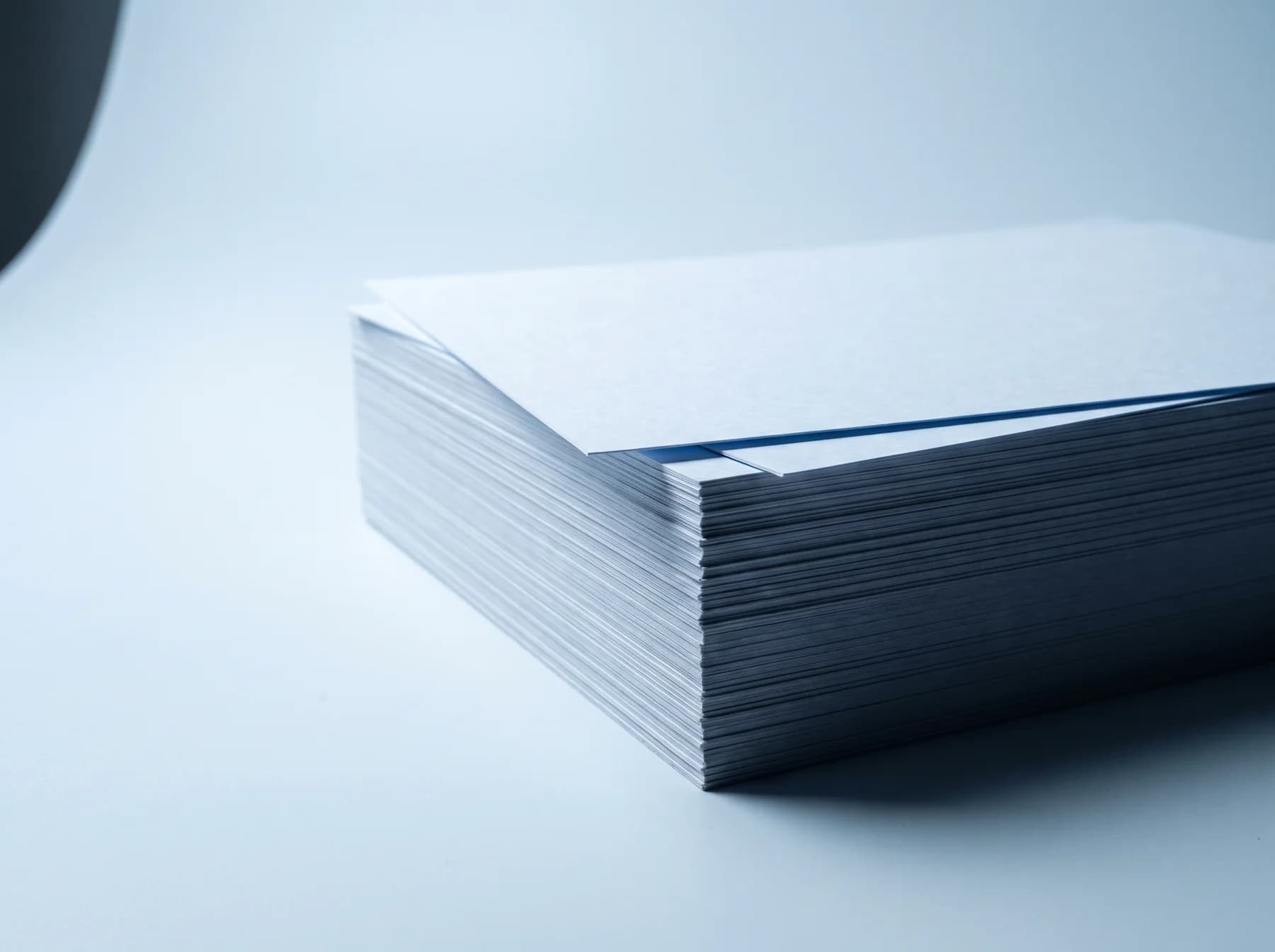 A thick stack of printed reports, seen edge-on.